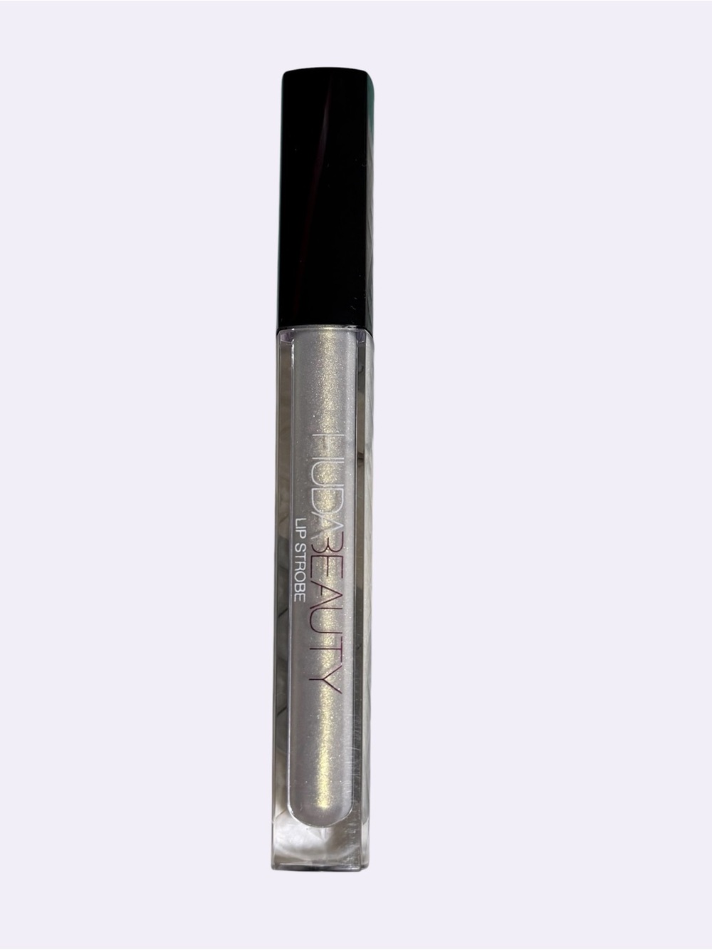 Huda Beauty Lip Strobe Shimmery pearl and Gold Lip Gloss in POSH